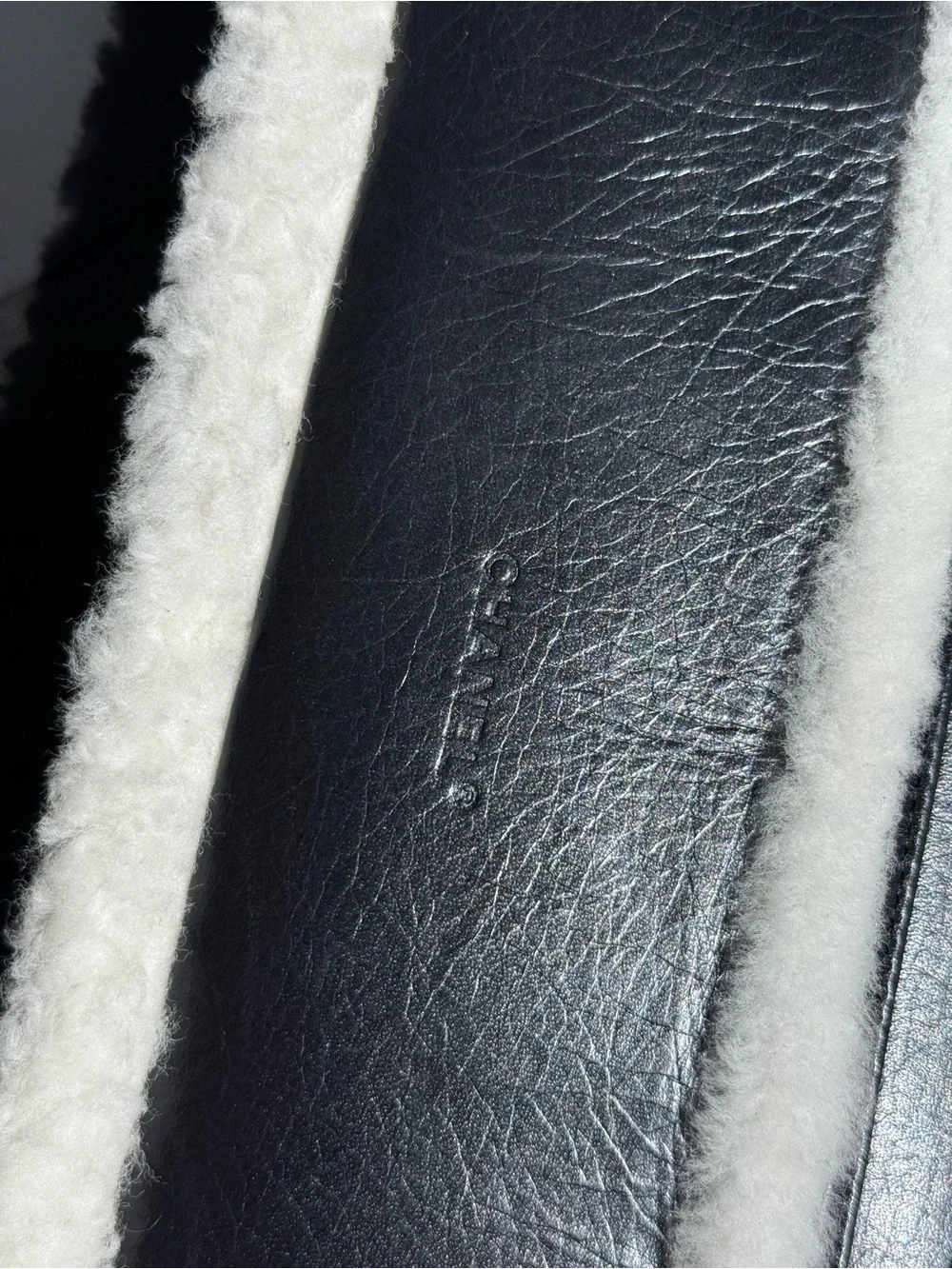 CHANEL Black Leather Shoulder Bag with White Shearling Trim